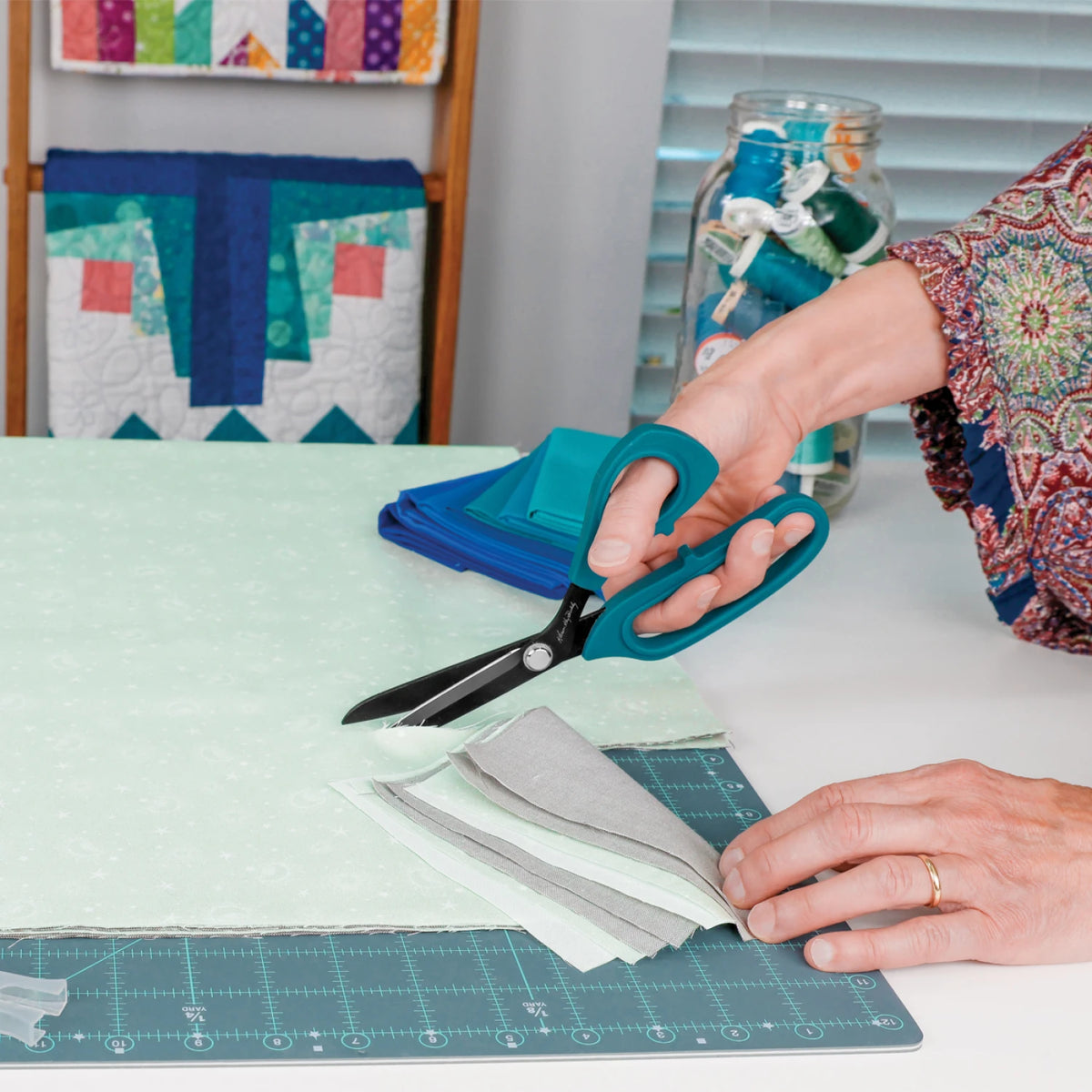 Perfect Scissors cutting through layered quilt fabric
