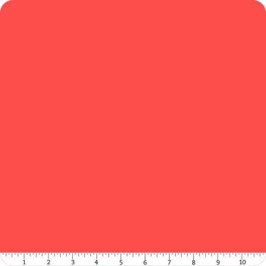 A 10-inch wide square of Riley Blake's Confetti Cotton™ Cayenne Solid Fabric Yardage is displayed on a white background, with a ruler at the bottom for scale.