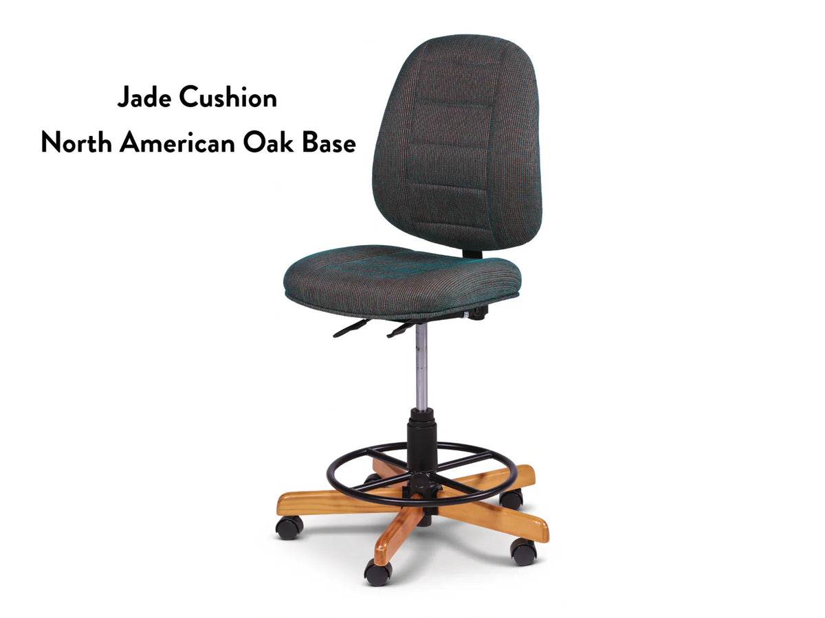 Koala SewComfort Chair features a green "Jade Cushion," ergonomic design, adjustable height, foot ring, and sturdy North American oak base with five wheels. Text on image: Jade Cushion, North American Oak Base.