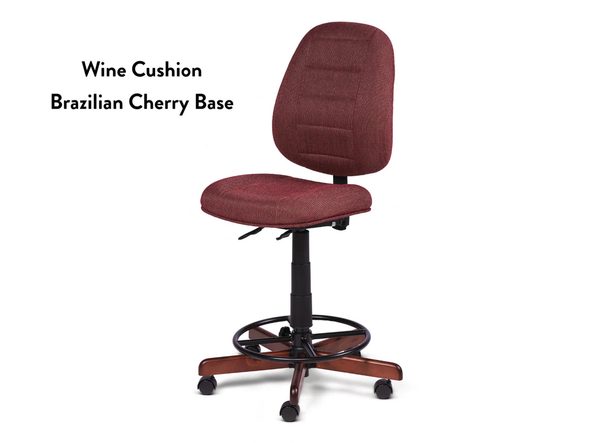 The Koala SewComfort Chair features a tall ergonomic design, wine-colored cushioned seat and backrest, adjustable height, black frame, and a five-star Brazilian cherry wood base with casters. Text reads: "Wine Cushion Brazilian Cherry Base.