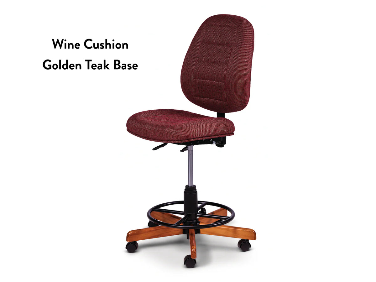 The Koala SewComfort Chair features a wine cushion, black adjustable metal frame, round footrest, and a five-legged golden teak wood base with black caster wheels. Text reads: Wine Cushion Golden Teak Base.