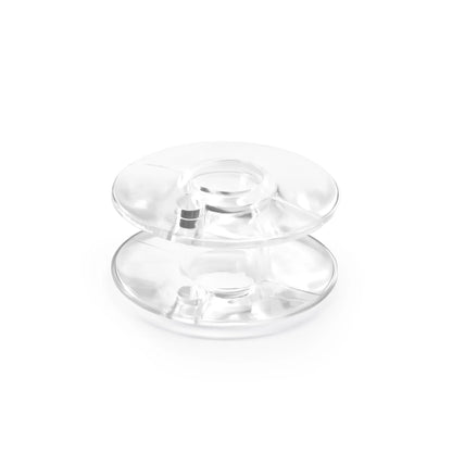 A Dritz 12 Count Plastic Class 66 Bobbin from Checker Distributor is shown standing upright on a white background.