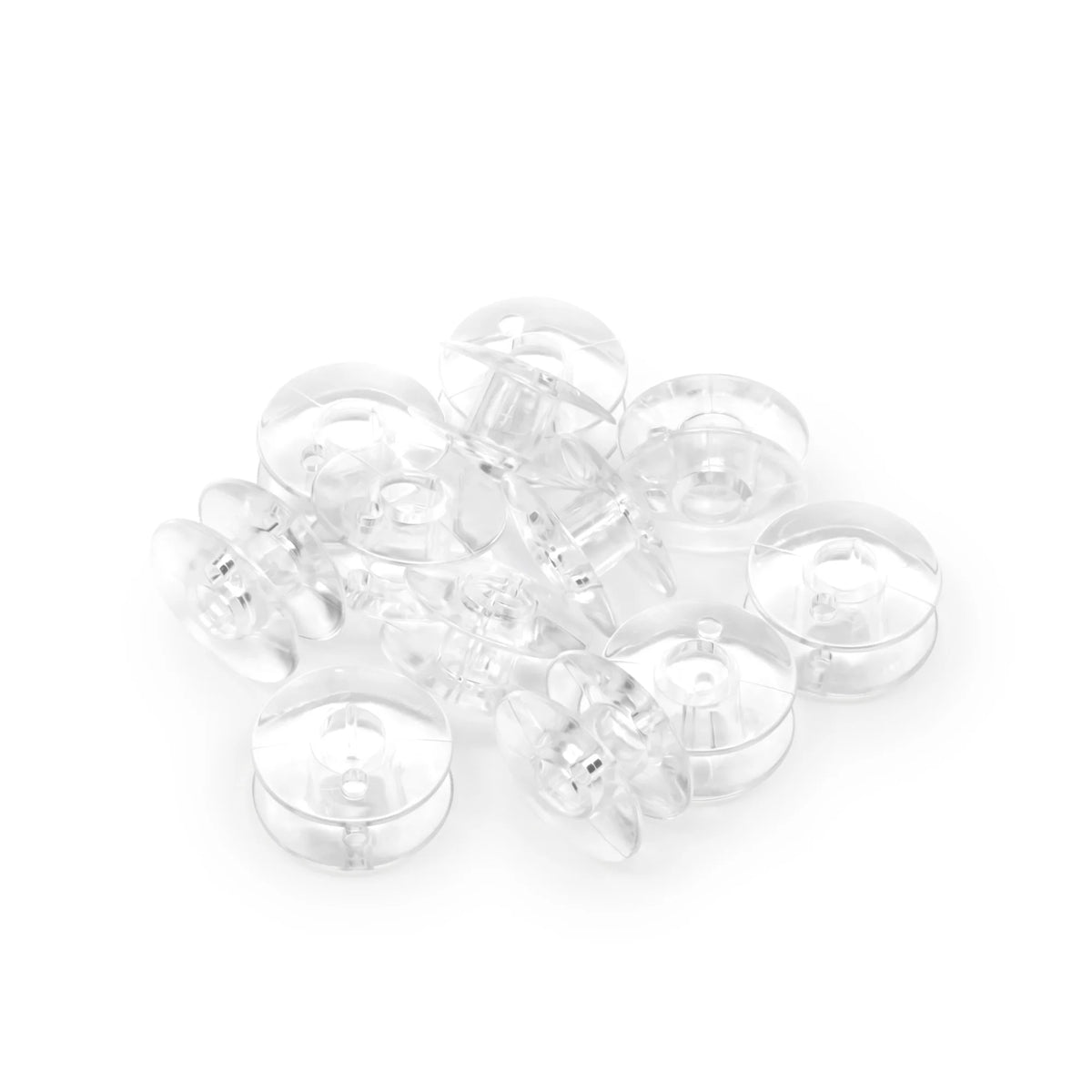 Dritz 12 Count Plastic Class 66 Bobbins by Checker Distributor are shown scattered in a pile on a white background.