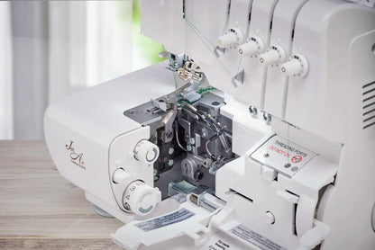 A close-up of the Baby Lock Celebrate Serger Machine on a wooden surface, showcasing its exposed threading mechanism, adjustable manual tensions, Jet-Air Threading system, and various control dials.