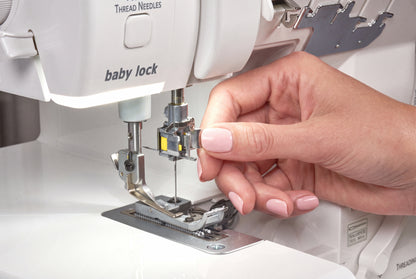 Baby Lock Serenity Serger machine serging fabric close-up