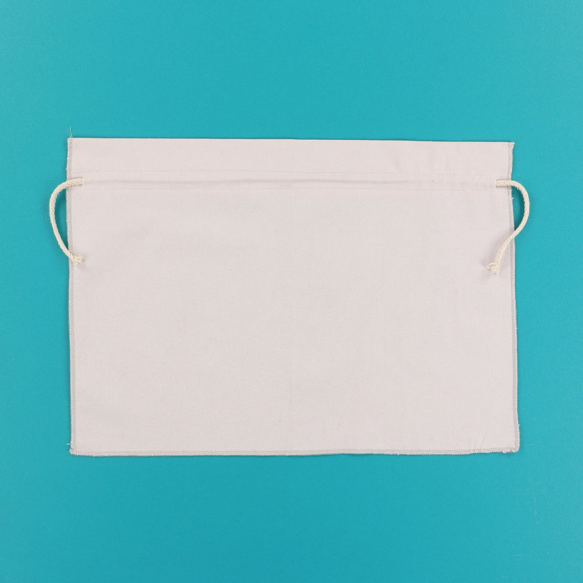 Kimberbell grey cinch sack shown flat with drawstring ends visible on teal background