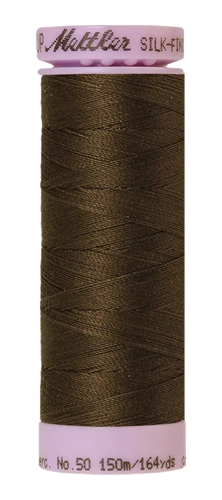 A spool of olive Mettler Cotton Silk Finish 50wt quilting thread, 150m/164yds, with a light pink base and cap.