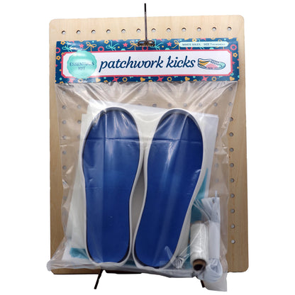 Patchwork Kicks White Essentials Kit components displayed on wooden pegboard with accessories
