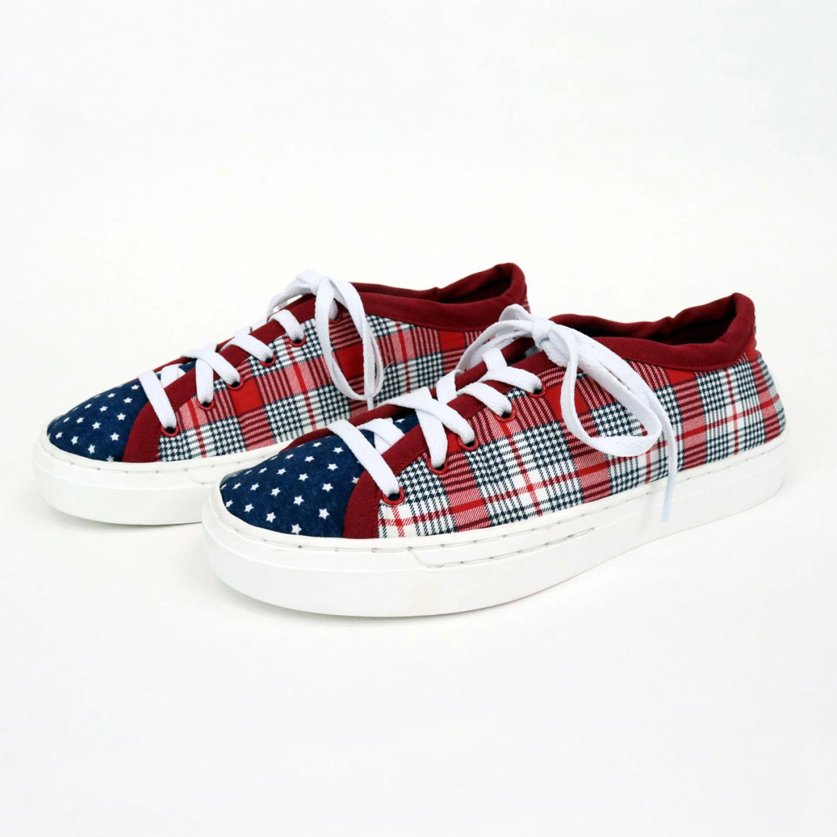 Completed Patchwork Kicks sneakers in red plaid and navy blue star pattern