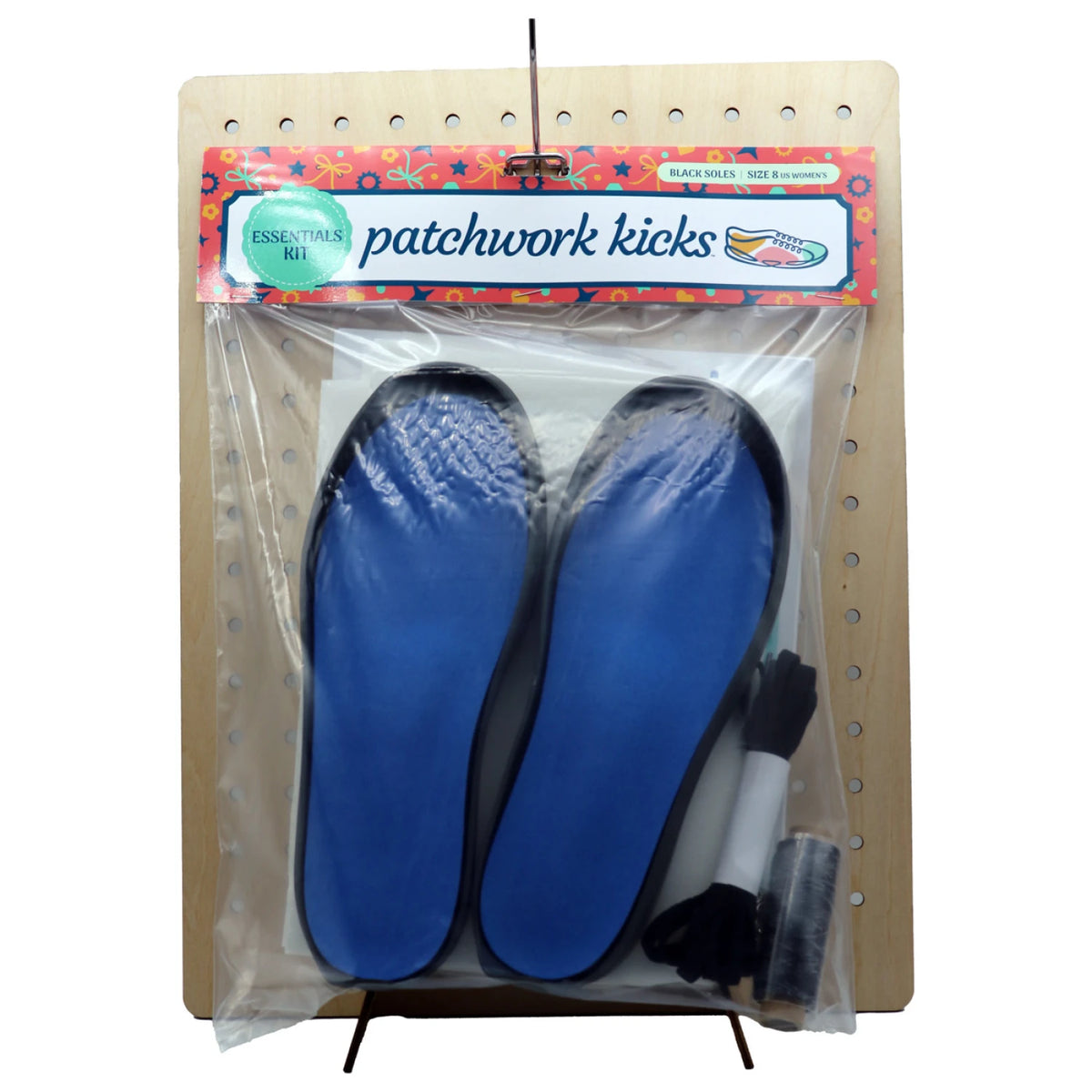 Patchwork Kicks blue insoles with gray flat sole bases displayed on board