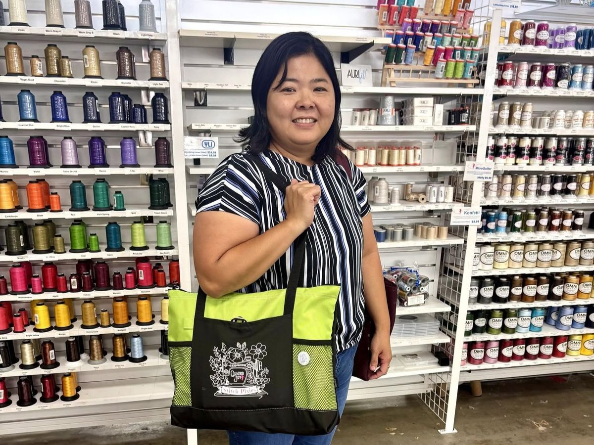 Stitch Pixies members in the Quilted Joy shop with their bags