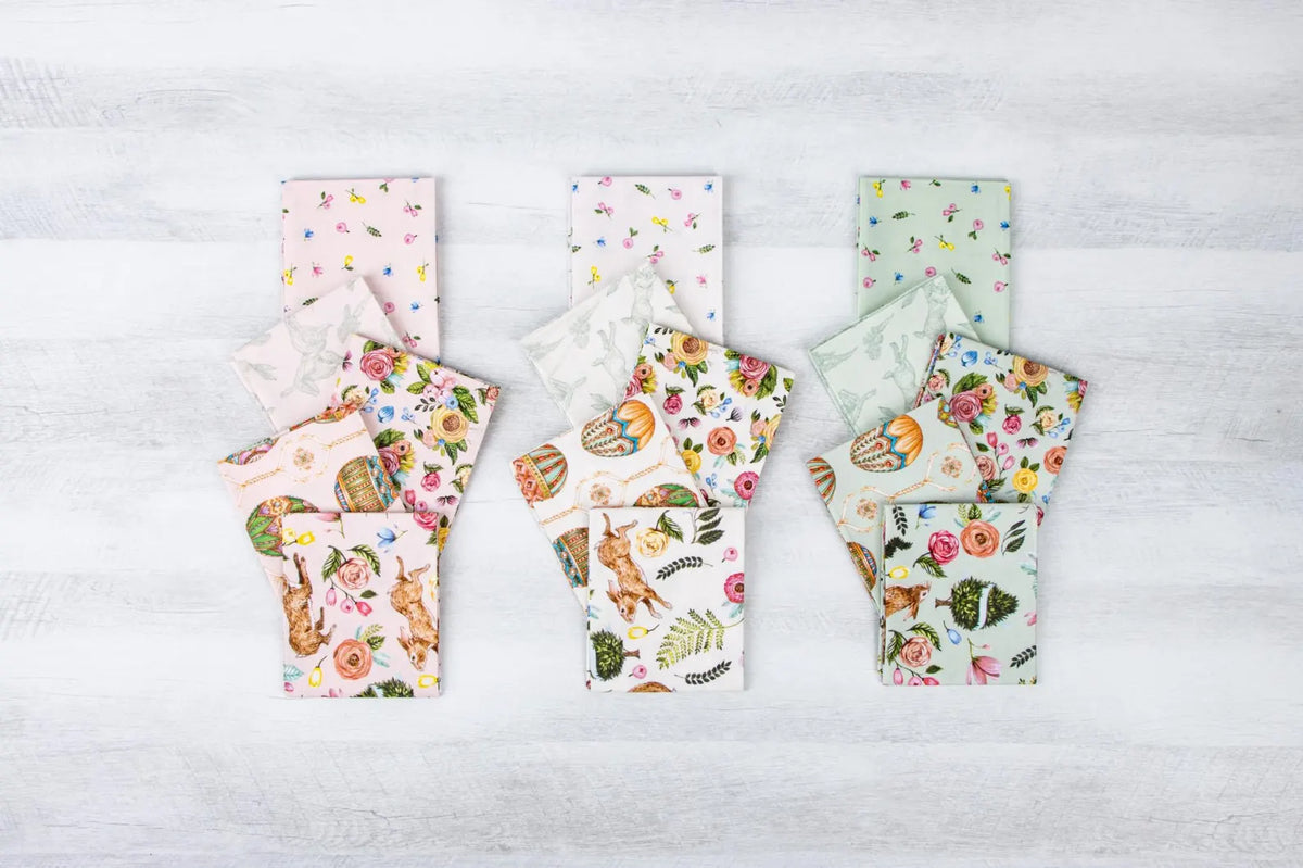 Set of floral-patterned products on a light wooden surface