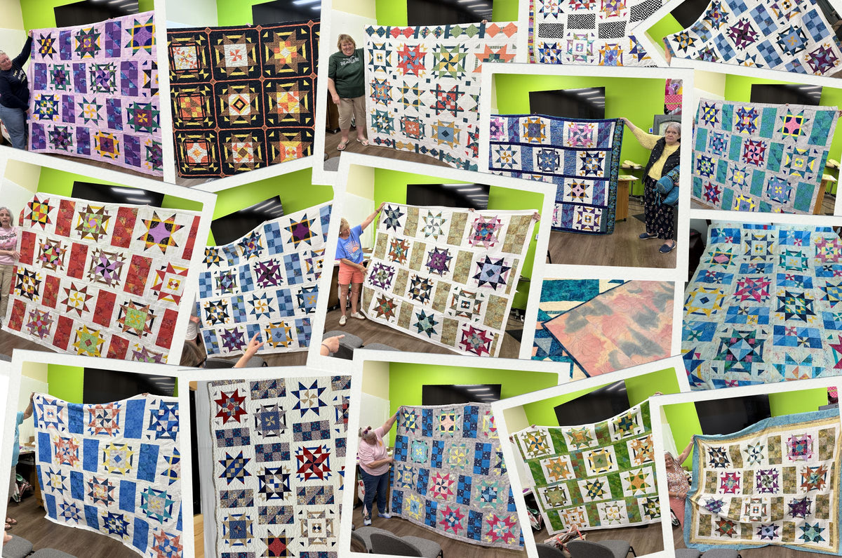 A collage of colorful patchwork quilts held by people in a room with green walls and TVs. The quilts display various star patterns and intricate designs in vibrant fabrics.
