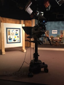 Angela took Pam's embroidered baby quilt to the Fons & Porter set