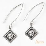 Lemoyne Star sterling silver earrings on long wire from Siesta Silver Jewelry. Available at quiltedjoy.live